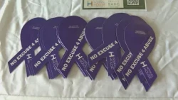 Advocacy center, lawmakers and community members mark the start of Domestic Violence Awareness Month